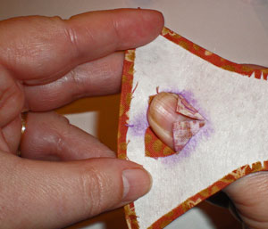 Turn the seam allowances of the cutout square with your fingers Turn the seam allowances of the cutout square with your fingers