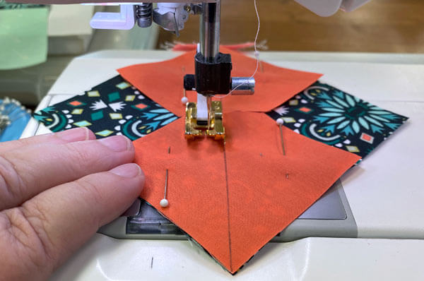 Stitch 1/4" away from both sides of the drawn line