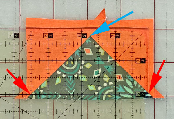 Trim away the excess from the first two sides