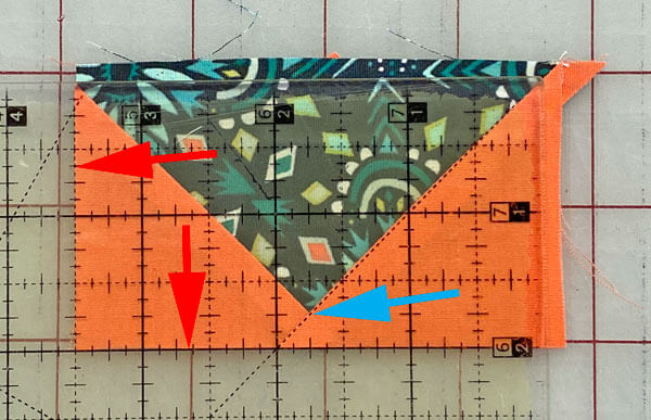 Trim away the excess from the remaining two sides