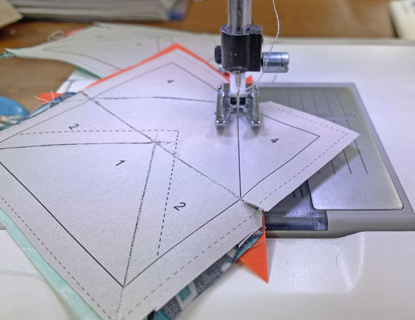 Sew from past the outside edges on both ends of the seam line Sew from past the outside edges on both ends of the seam line