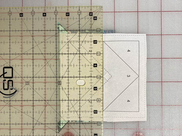 Align your ruler with the line through the center of the pattern