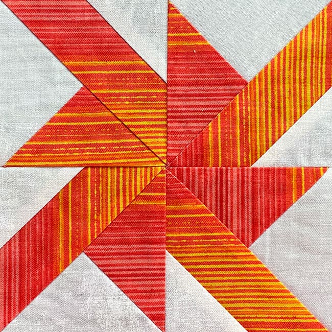 A finished, traditionally pieced Wheels quilt block