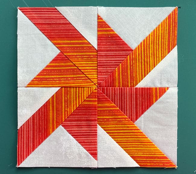 A finished, traditionally pieced Wheels quilt block
