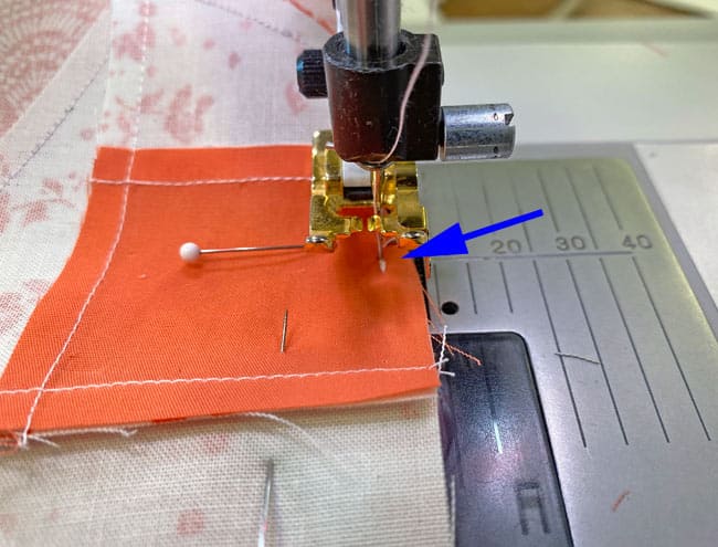 The final stitches to complete the original partial seam The final stitches to complete the original partial seam