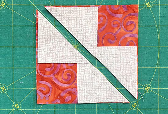 Cut the sewn patches in half Cut the sewn patches in half