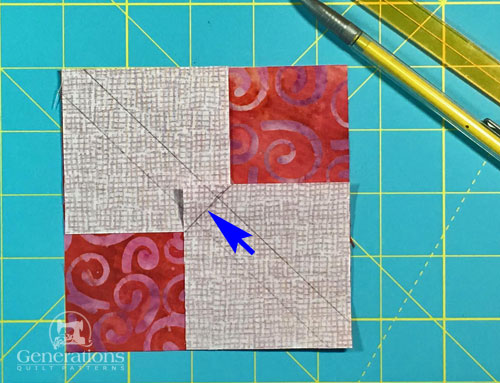 Draw a diagonal line perpendicular to the first two lines through the center of the patches Draw a diagonal line perpendicular to the first two lines through the center of the patches