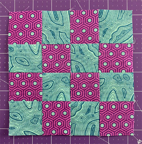 Four 4-patches are sewn together to create a field of squares.