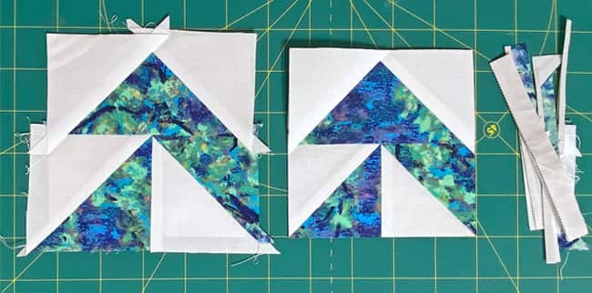 A Yankee Puzzle unit, untrimmed (left), trimmed (center) with the waste on the right